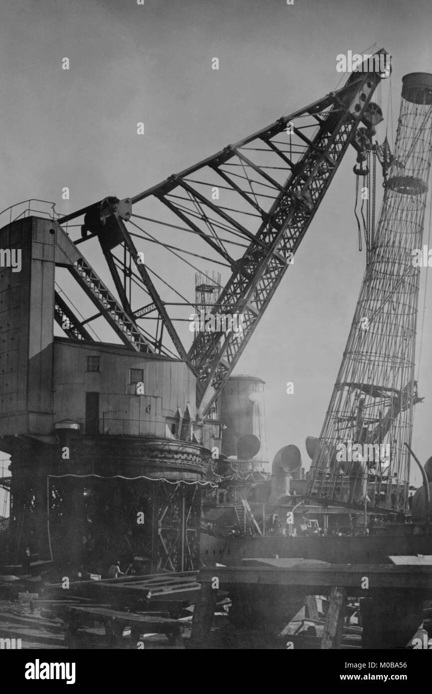 Giant Crane Lift Battleship Tower at Newport News Shipbuilding Stock Photo