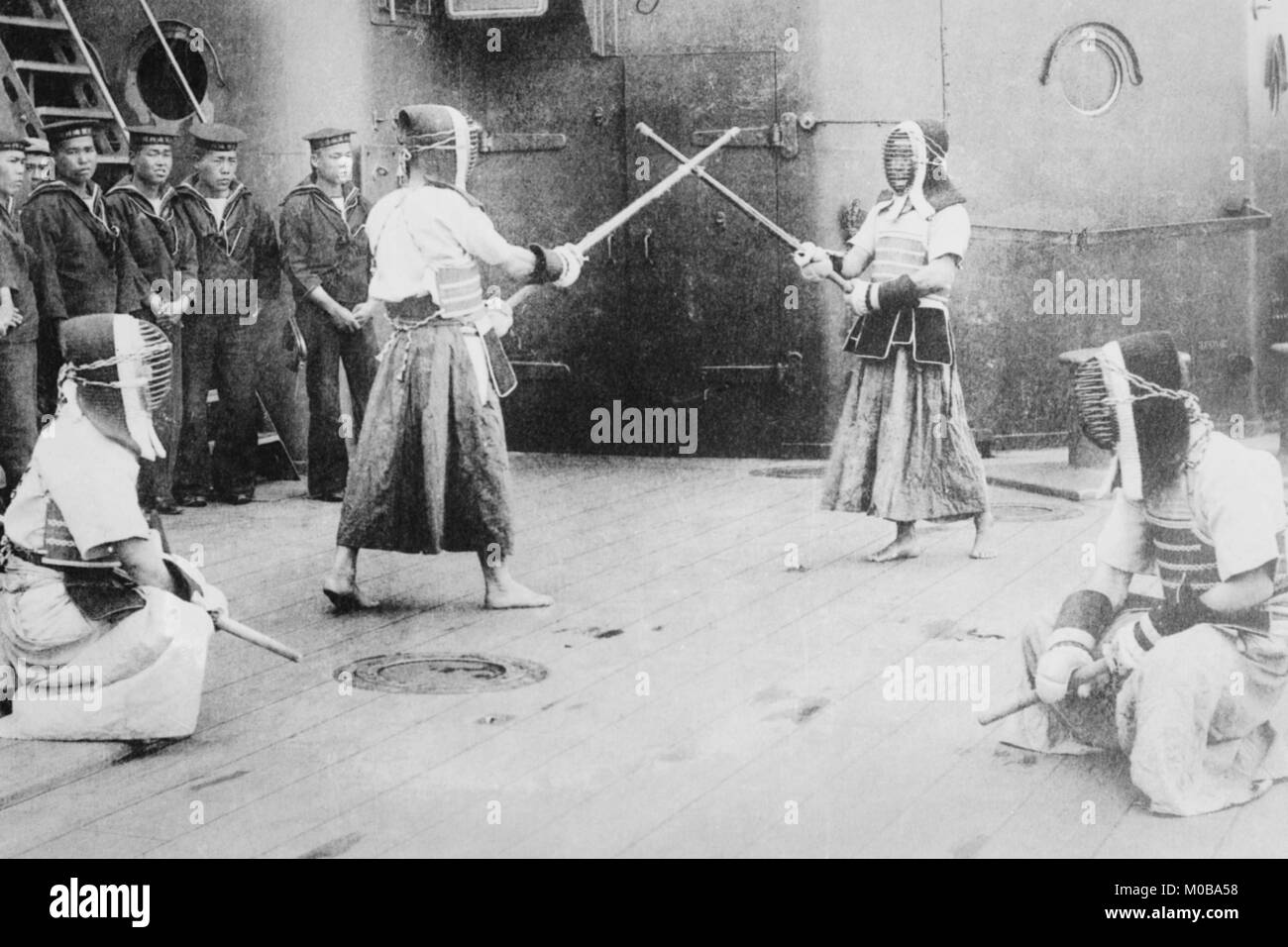 Japanese Sailors Fencing on Board Ship Stock Photo