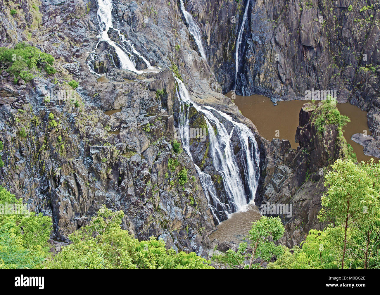 A decent wet season amount of water flowing over the lower tiers of the Barron River Falls in the Barron Gorge National Park near Kuranda, Queensland Stock Photo