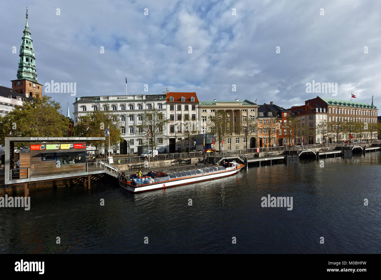 Copenhagen, Denmark - November 7, 2016: People in the tour boat at Ved Stranden street. Sightseeing tours is very popular among tourists Stock Photo