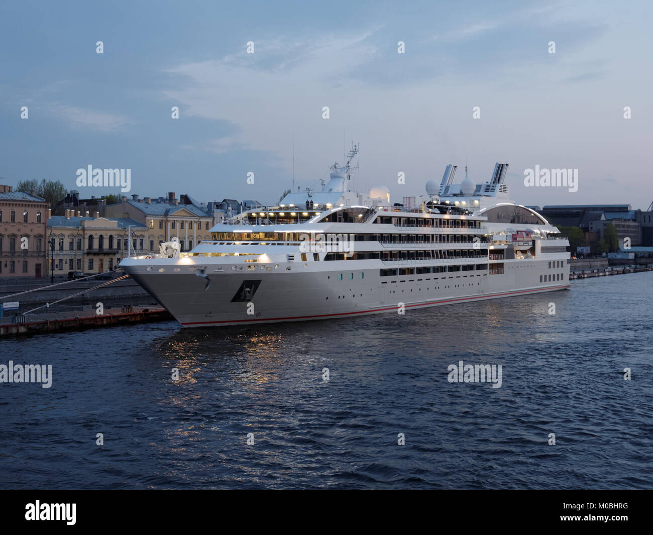 St. Petersburg, Russia - May 19, 2017: Cruise liner Le Soleal moored at English embankment. Designed in 2013, the ship owned by PONANT has only 132 st Stock Photo