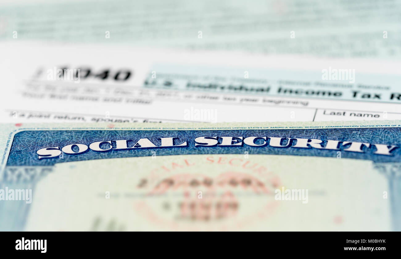 USA Social Security Card on calculations of tax for retirement Stock Photo