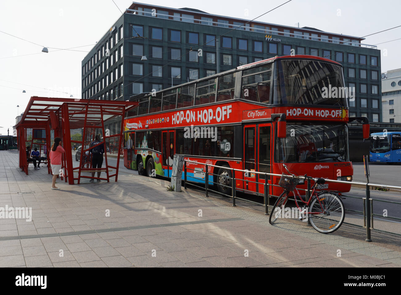 Helsinki, Finland - August 21, 2016: Tourists in the sightseeing tour bus in the city center. Hop-On Hop-Off buses departs from Senate square every 20 Stock Photo