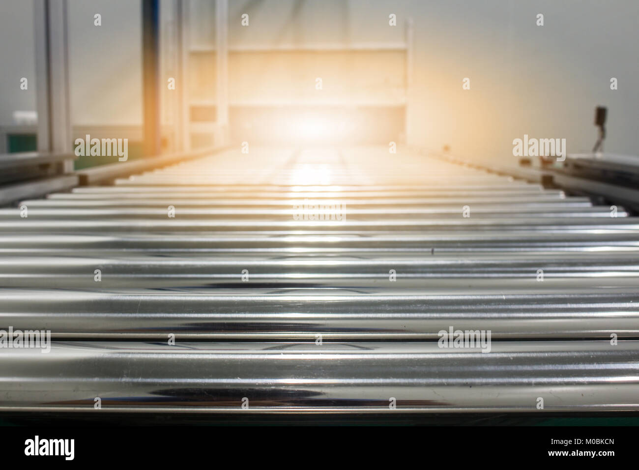 The conveyor chain, and conveyor belt on production line set up in clean room area. Stock Photo