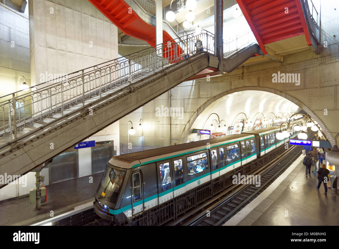 Paris, France - September 13, 2013: Train arrives on the Cite station of Paris metro. It is the second busiest metro system in Europe, after Moscow Stock Photo