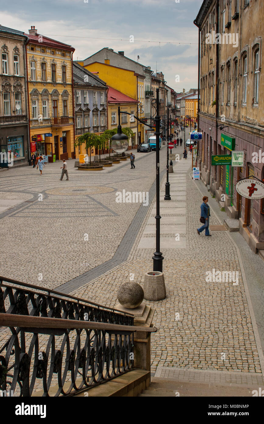 Przemysl, Poland - August 24, 2006: People walking on the Franciszkanska street viewed from the entrance to the Franciscan’s Church. Church was built  Stock Photo