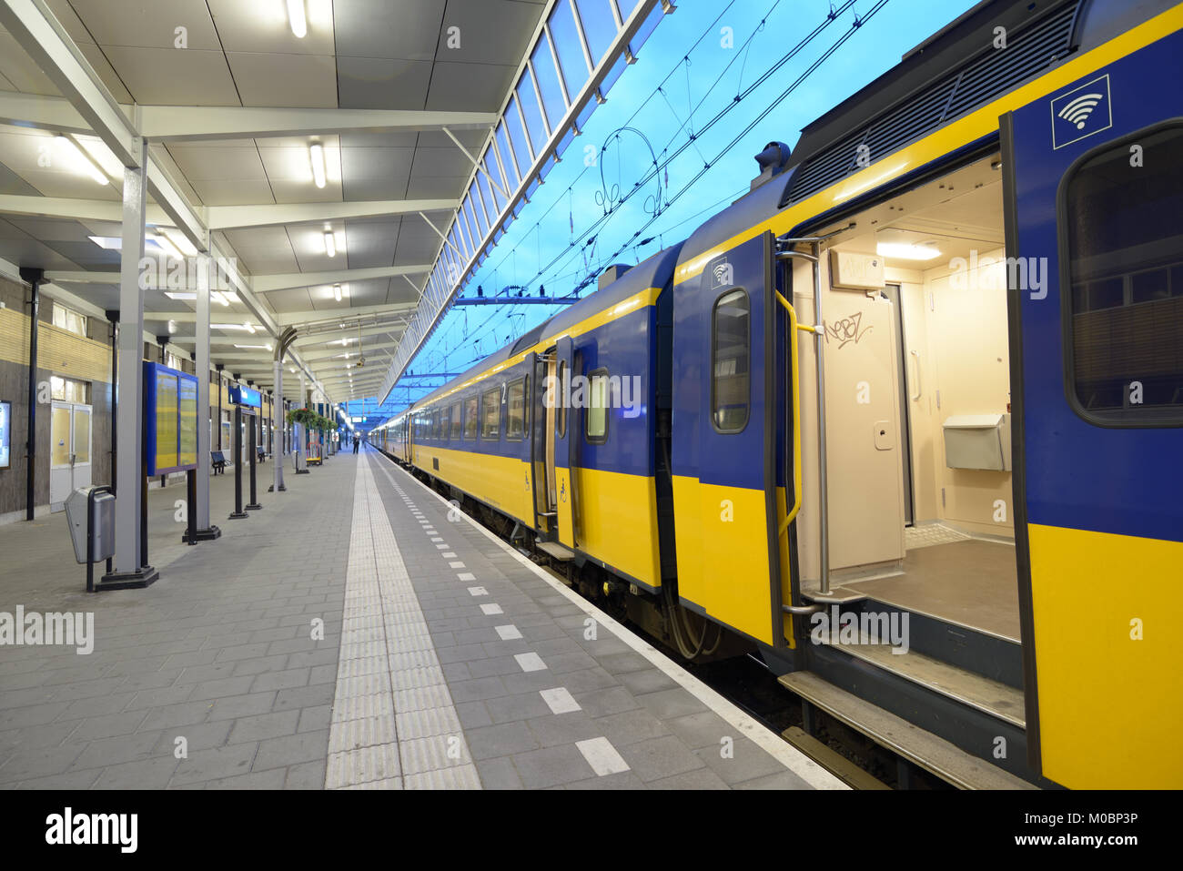 Venlo, Netherlands - June 22, 2013: Commuter train on a train station of Venlo, Netherlands on June 22, 2013. Dutch trains are on the whole punctual w Stock Photo