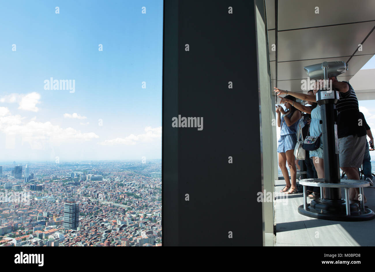 Istanbul, Turkey - June 30, 2012: Tourists admire the cityscape from the observation desk on the Sapphire building. Sapphire rises 54 floors above gro Stock Photo