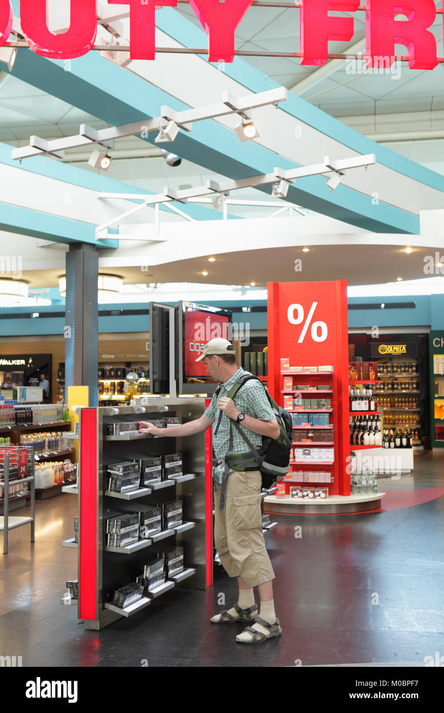 duty free cigarettes turkey Istanbul, Turkey - August 21, 2011: Tourist selects cigarettes in duty free  shop in Ataturk international airport, Istanbul, Turkey on August 21, 2011  Stock Photo
