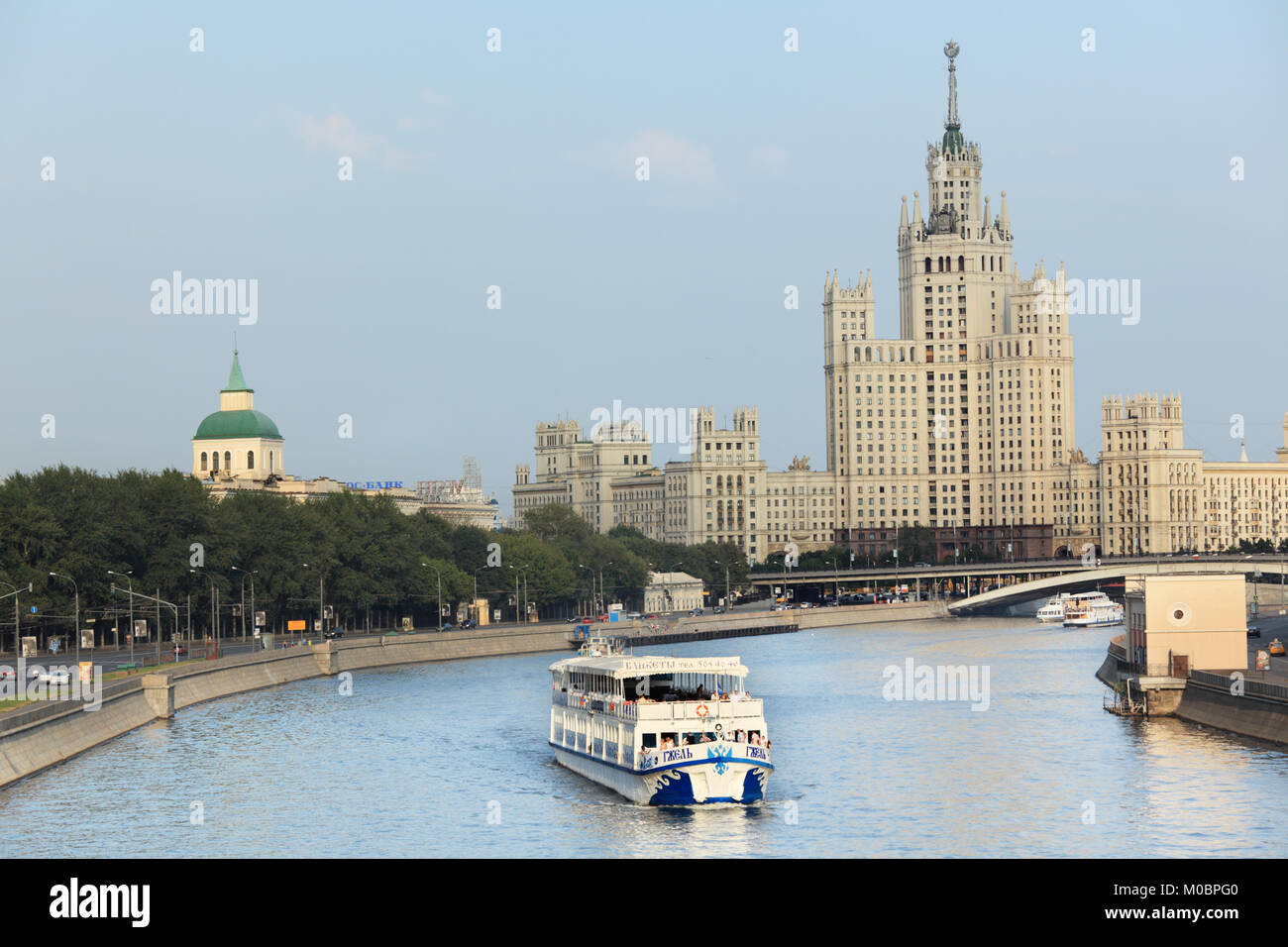 Moscow, Russia - July 31, 2010: Trip boat on Moscow river against one of Seven Sisters in Moscow, Russia on July 31, 2010 Stock Photo