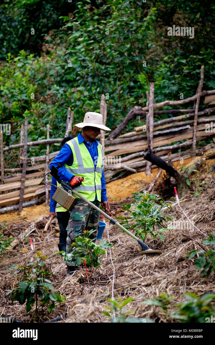 Un exploded Ordinance team works to clear UXO in Sekong Province Laos ...