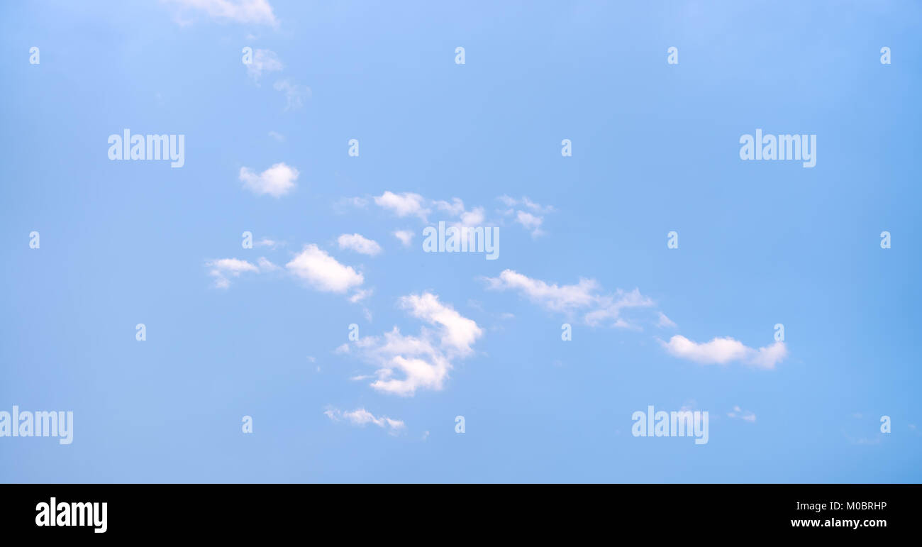 Nice cloud shapes on the bue bright sky as background Stock Photo