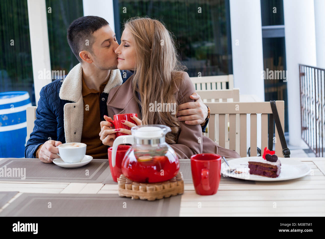 restaurant. a guy with a girl drink hot coffee and tea Stock Photo Alamy