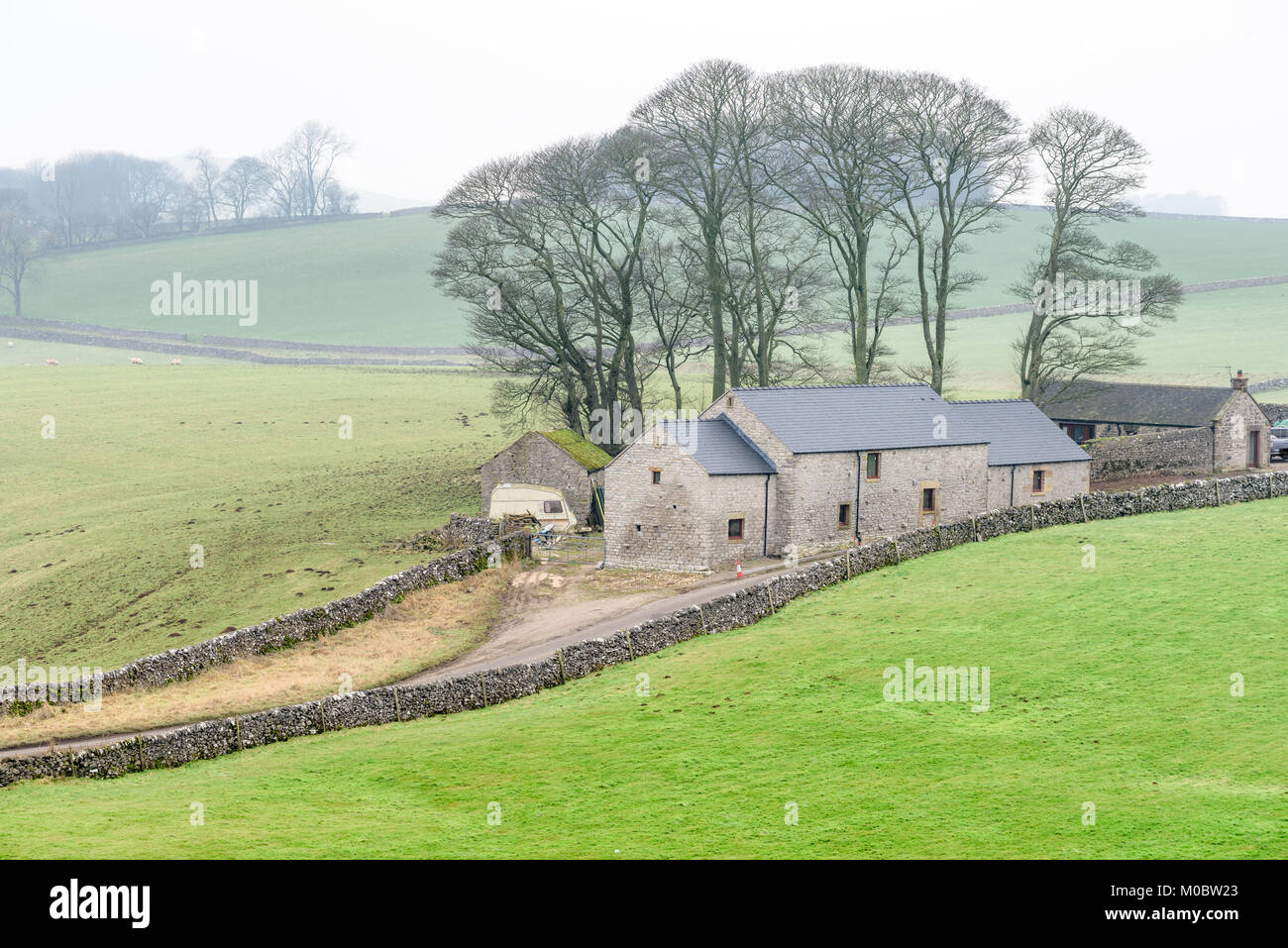 Refurbished farm house as seen from the Tissington trail in mid winter on the Peak district at Alsop moor, Derbyshire, England. Stock Photo