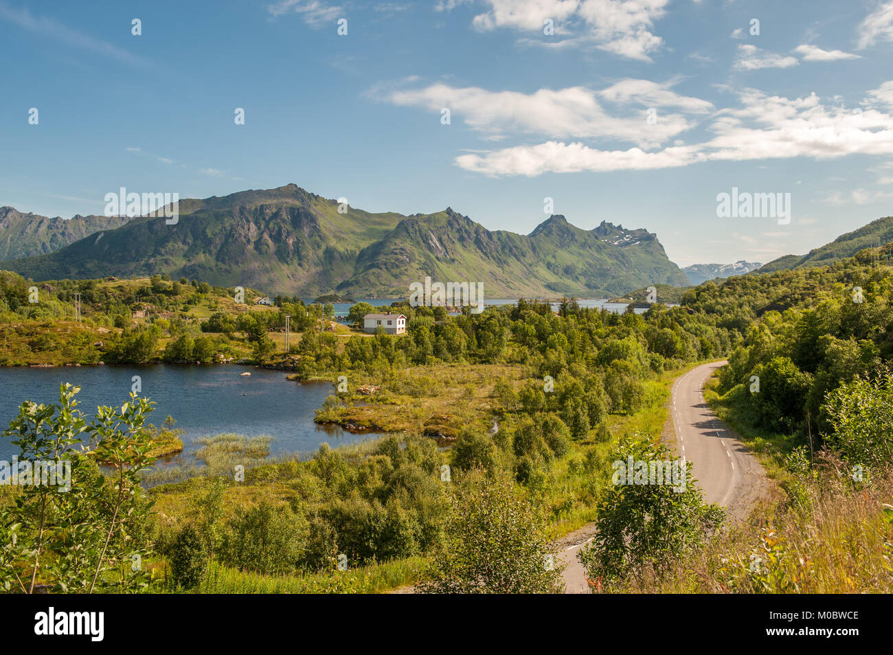 Route E10 winding through scenic summer landscape at Lofoten in northern Norway Stock Photo