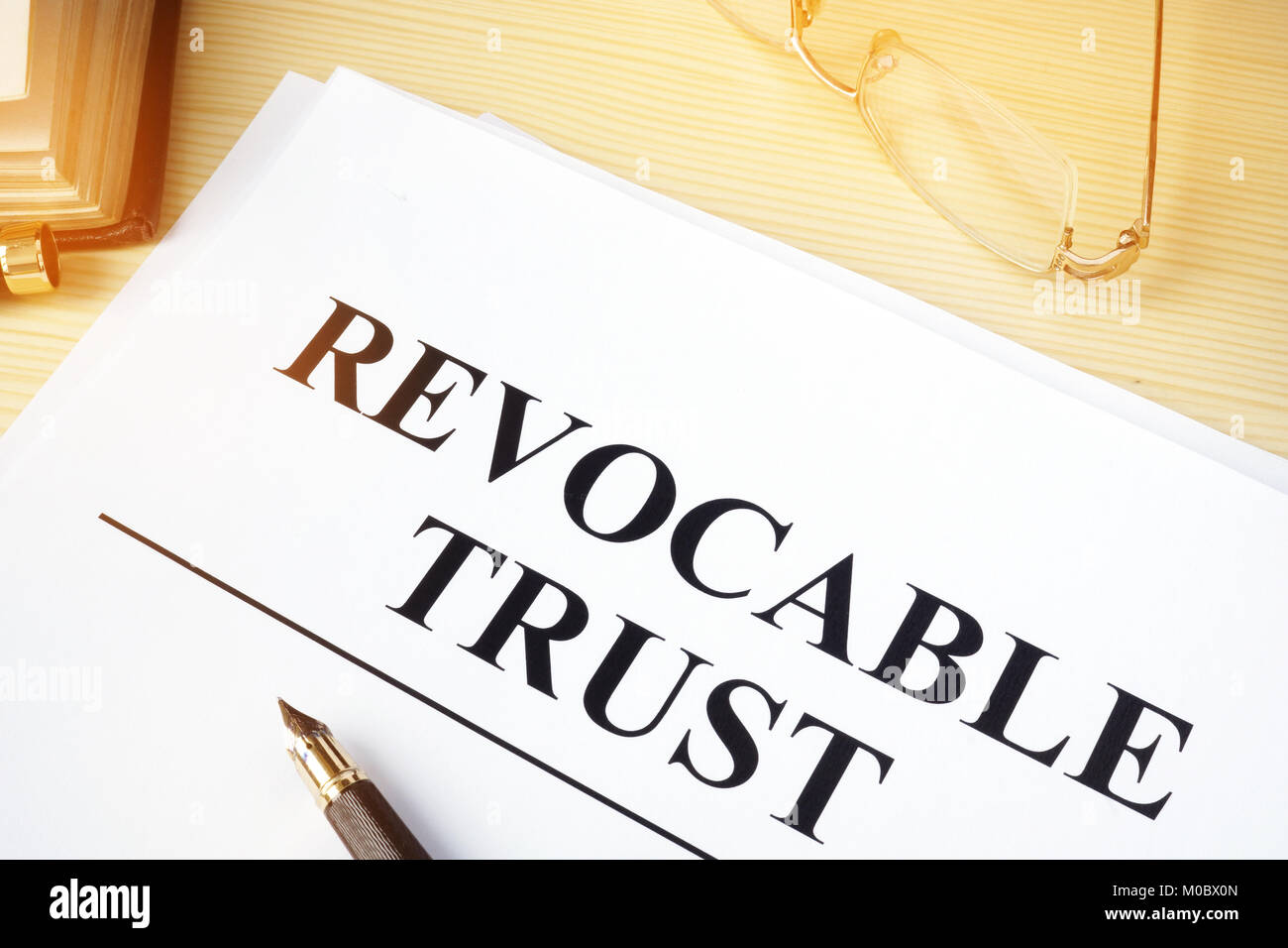 Revocable trust on a wooden desk. Stock Photo