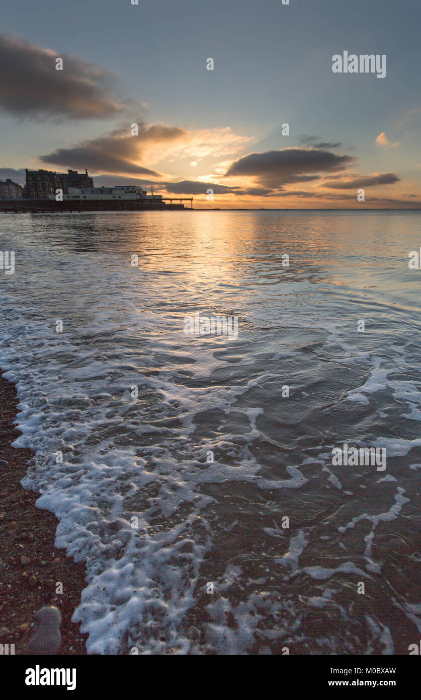 Town of Aberystwyth, Wales. Picturesque sunset view of Aberystwyth’s Royal Pier. Stock Photo