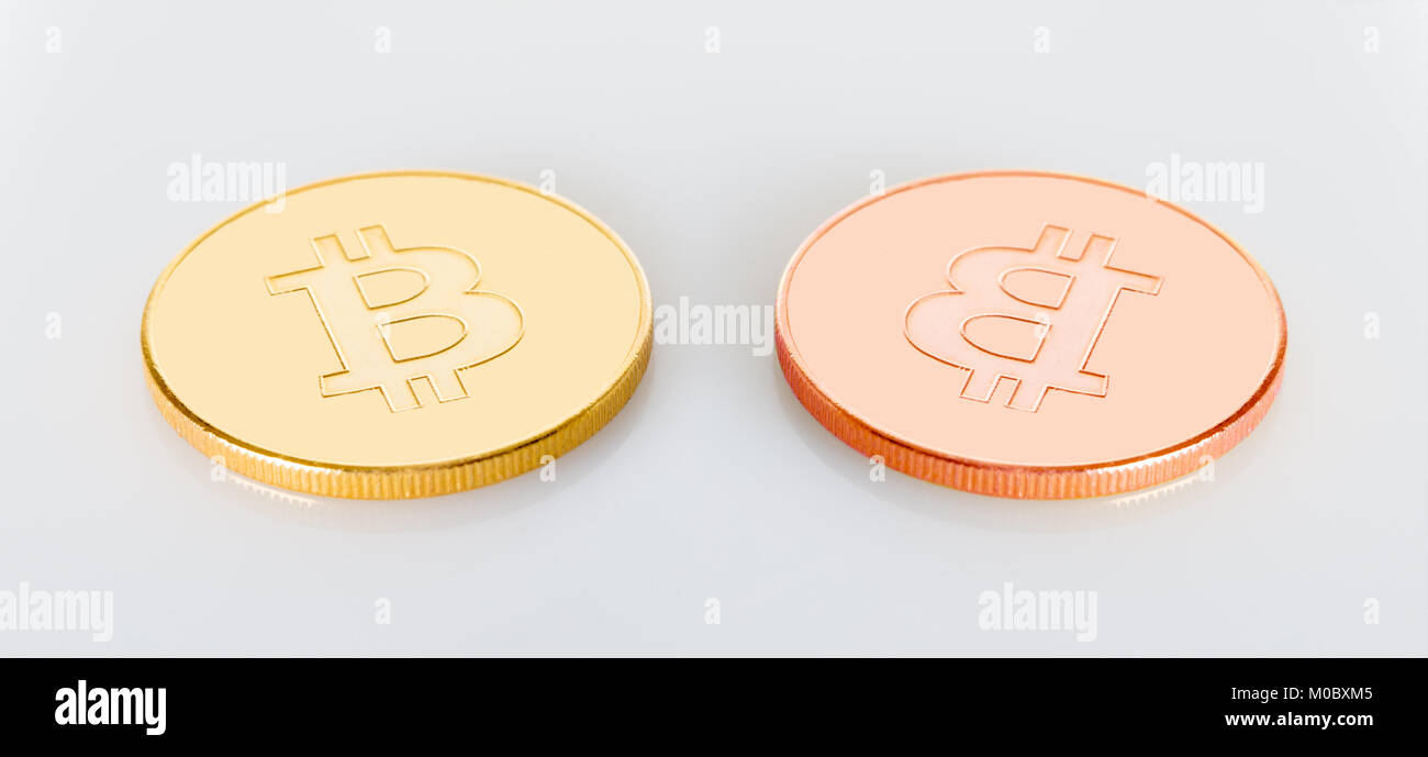 two bitcoins crypt money on a white background Stock Photo - Alamy