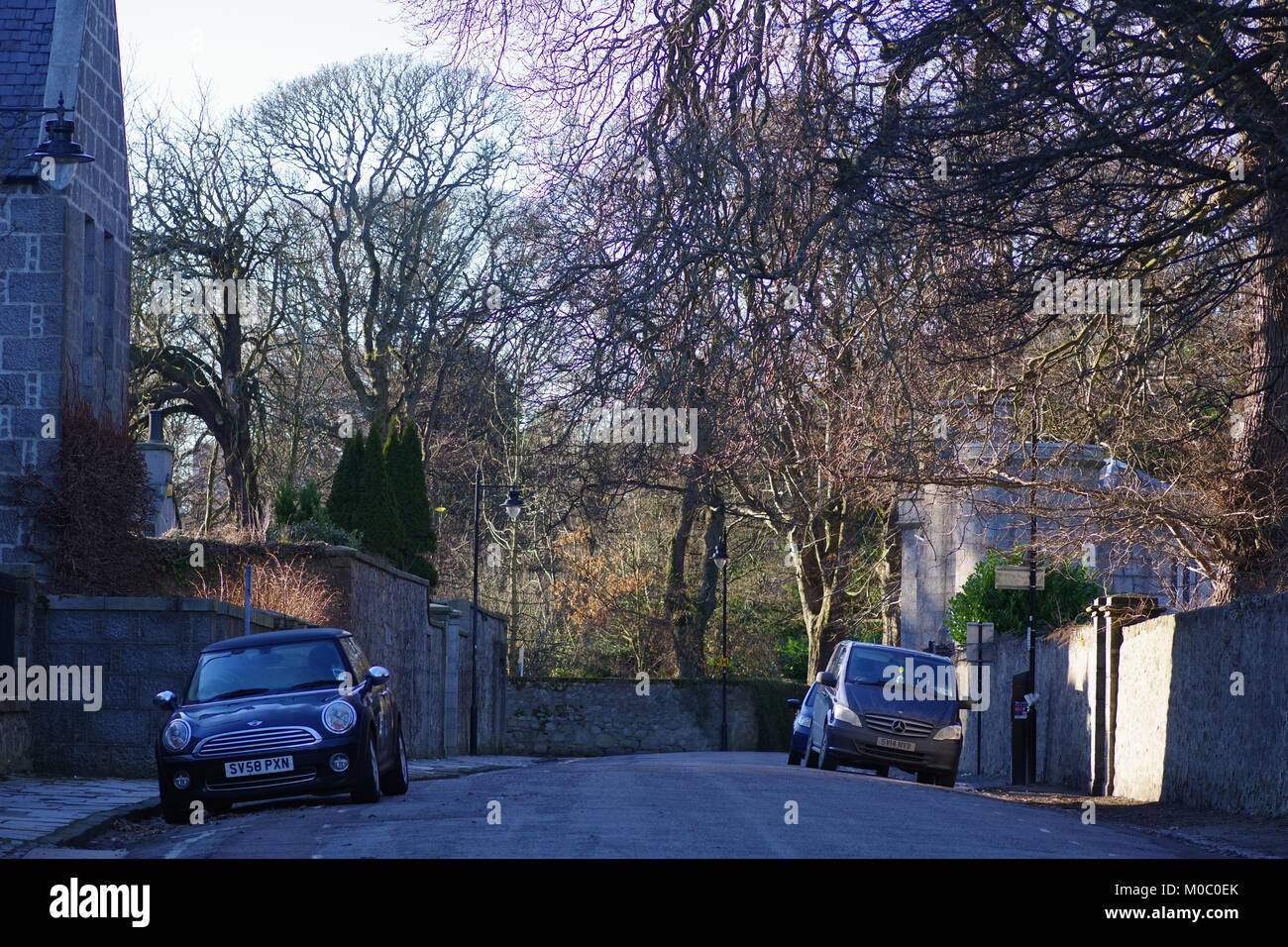 The Chanory Road. St Machar's Cathedral and Parked Cars in the Gloom of Winter, Old Aberdeen Town. Aberdeen, Scotland, UK. Stock Photo