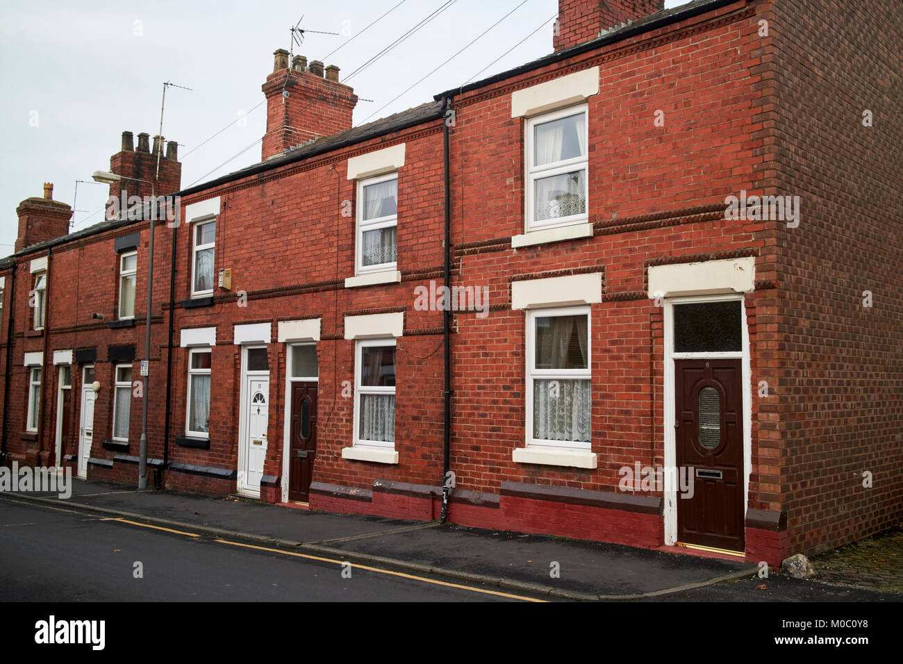 two bedroomed red brick victorian terraced houses ward street st helens merseyside uk Stock Photo