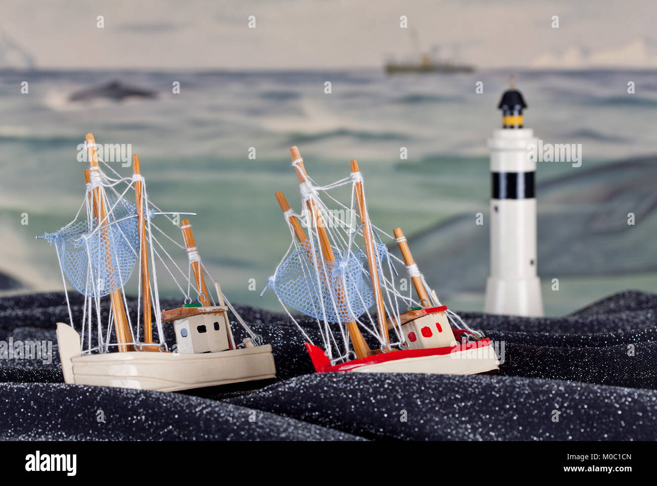 View Of Toys Fishing Boats On A Spotted Fabric Material Old School Painting As Background Beacon Stock Photo Alamy