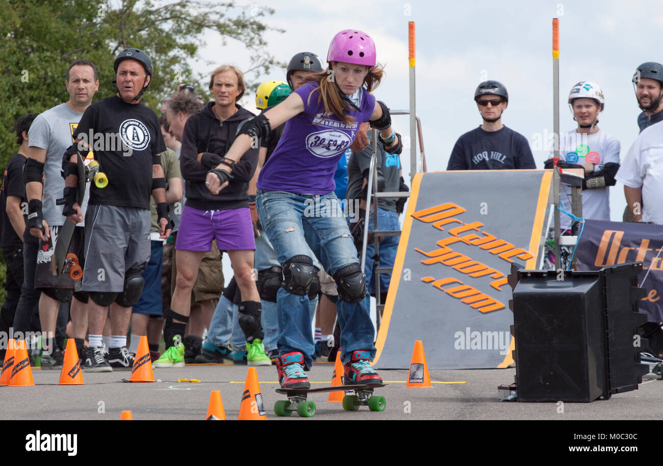 Woman skateboarder competing in a slalom Stock Photo