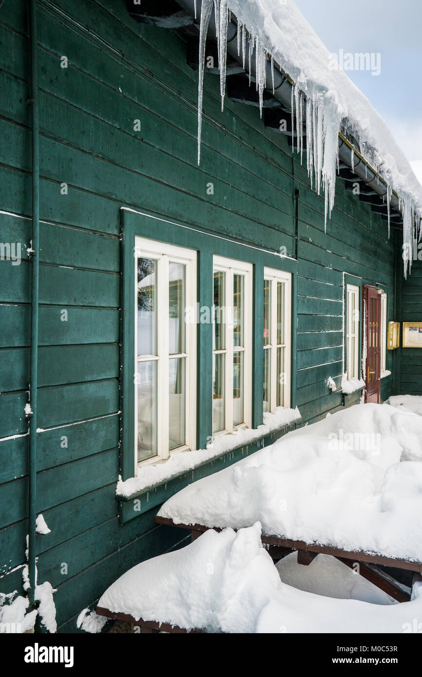 Long icicles hanging from a building in Harz Stock Photo