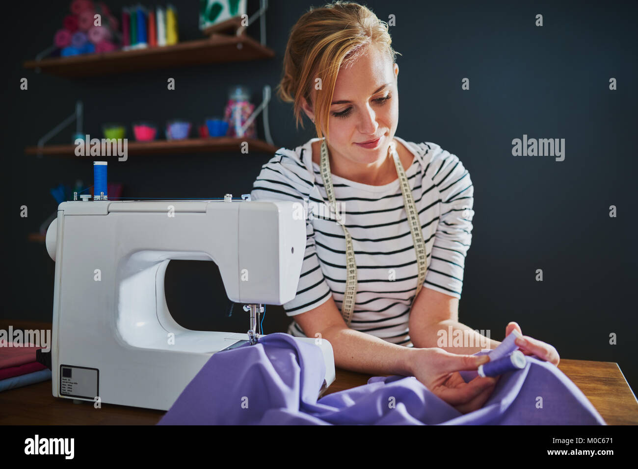 Woman sewing clothes, fashion designer working Stock Photo