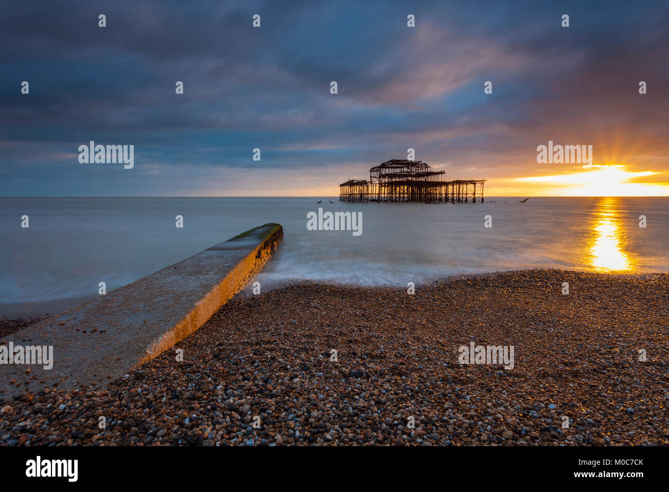 Sunset at West Pier ruins in Brighton, East Sussex, England Stock Photo ...