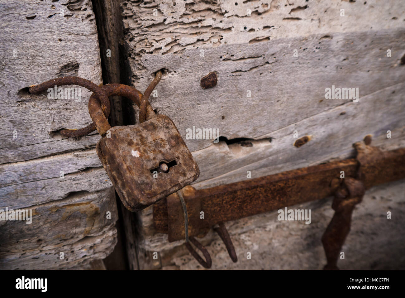 Close up of rusty lock of an old wooden door Stock Photo - Alamy