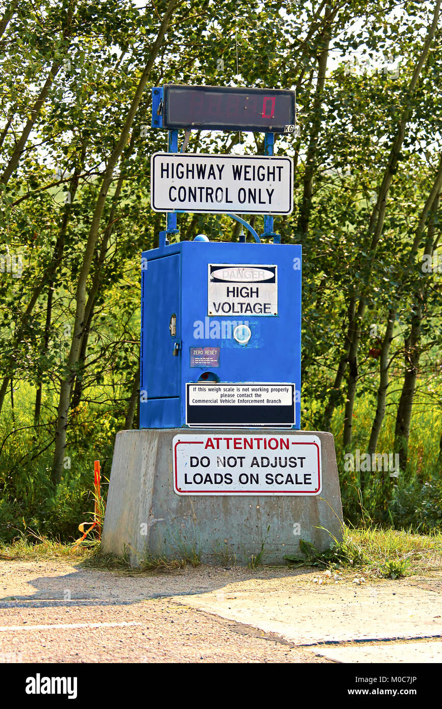 A Highway Weight Control sign and scale location Stock Photo