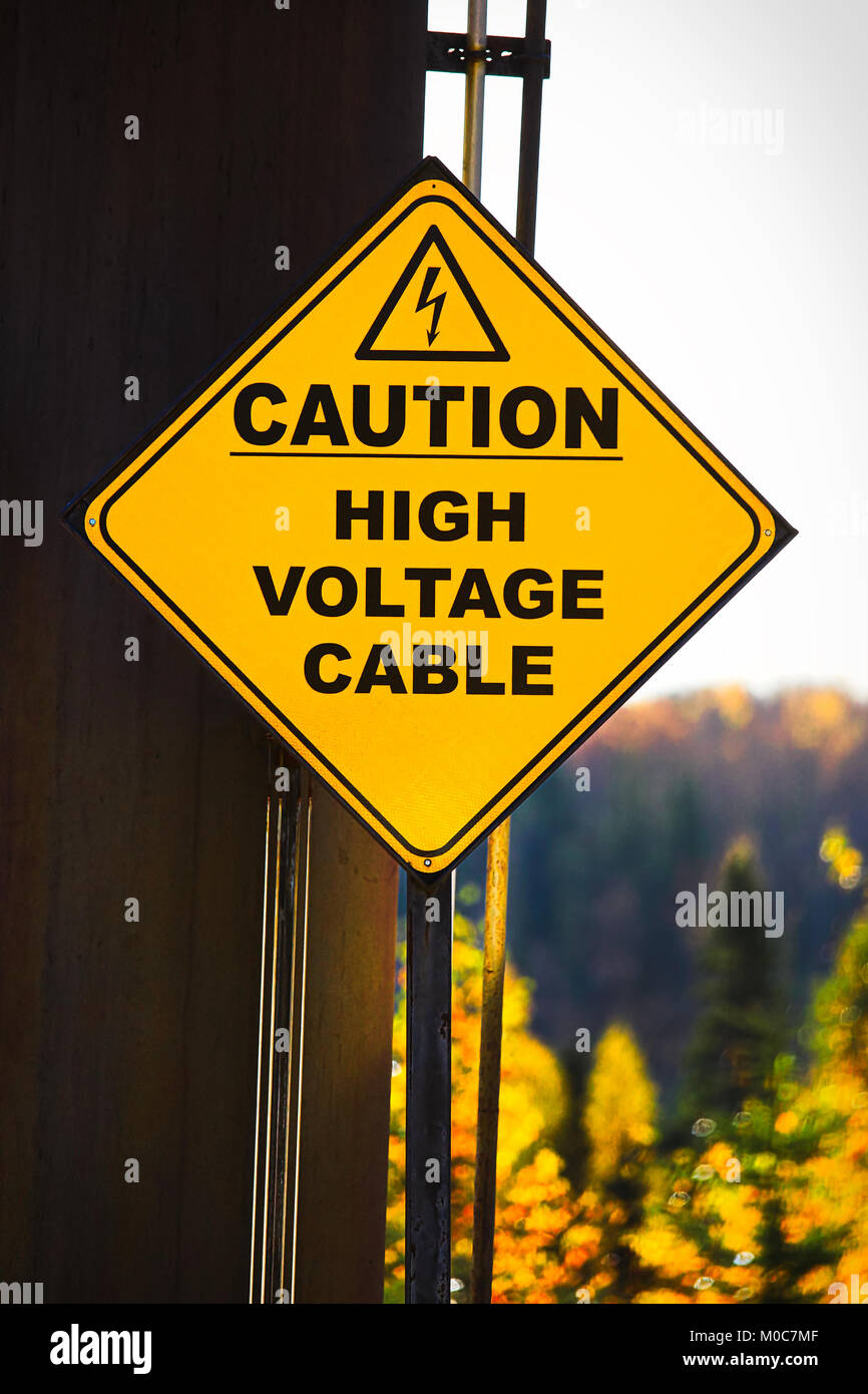 A yellow Caution High Voltage Cable sign Stock Photo