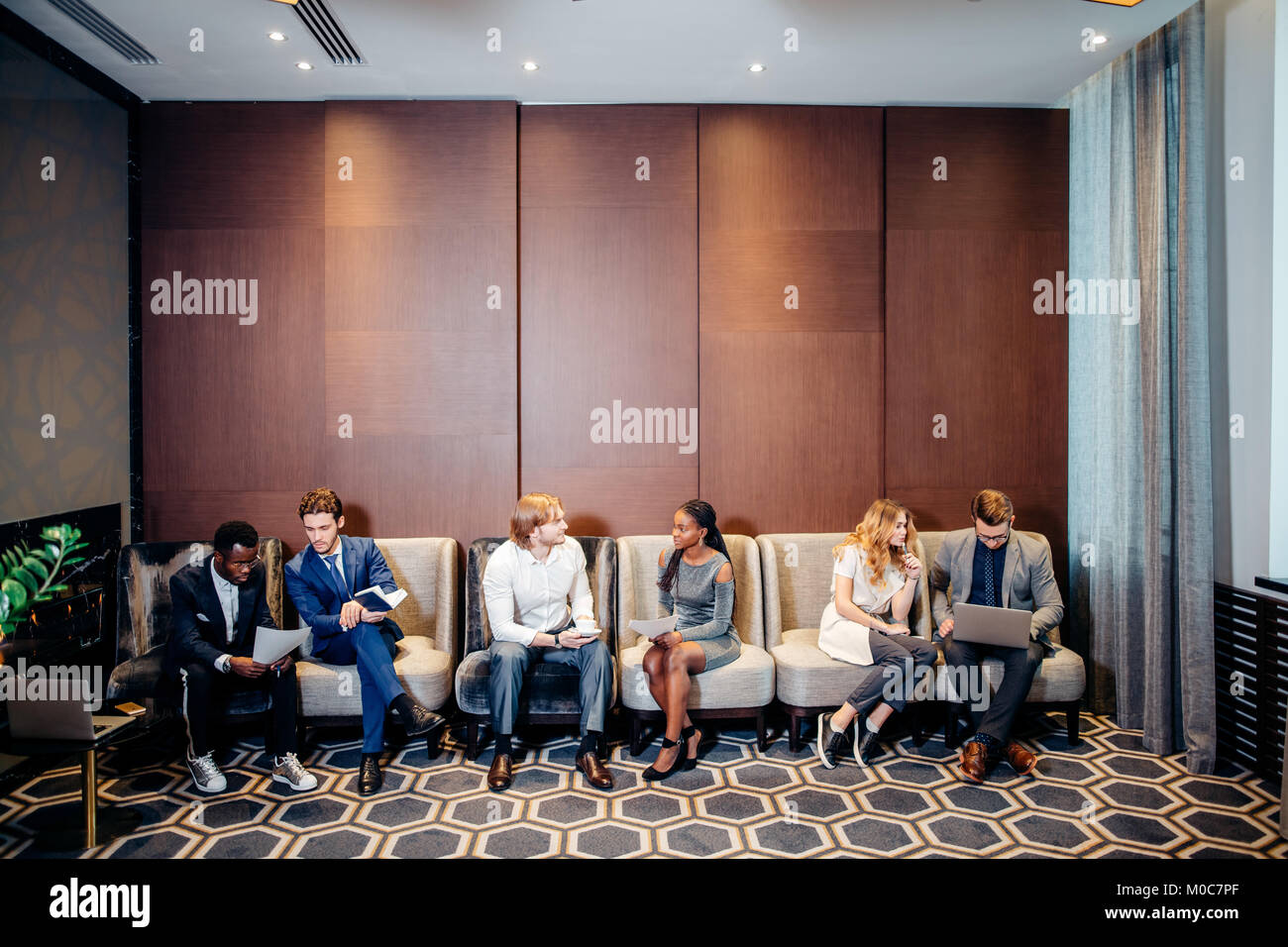 Business people waiting for job interview, talking Stock Photo