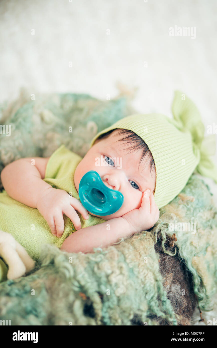 portrait of a newborn with a pacifier Stock Photo