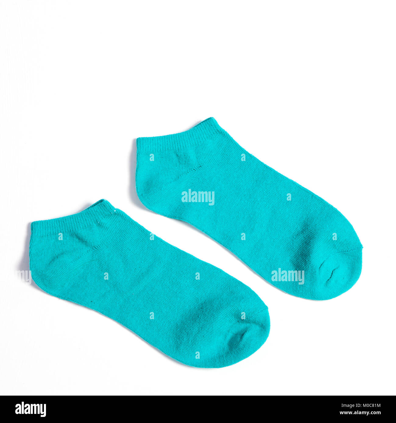 The green socks on white background Stock Photo - Alamy