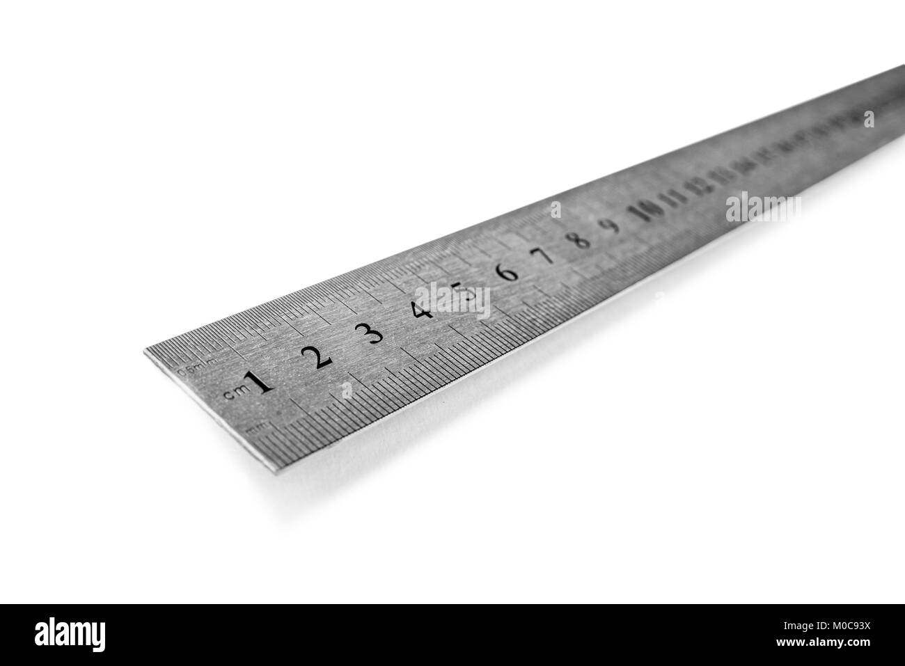 Metal ruler in centimeters or inches. Measuring tool on the white background Stock Photo