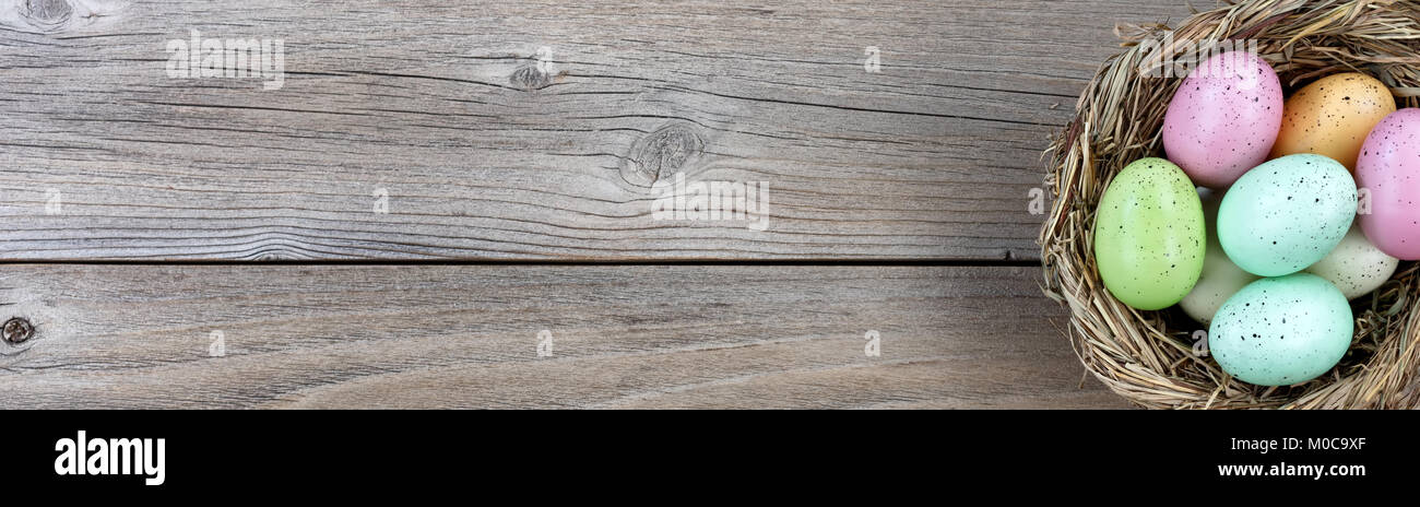 Natural bird nest and colorful eggs on weathered wood Stock Photo - Alamy