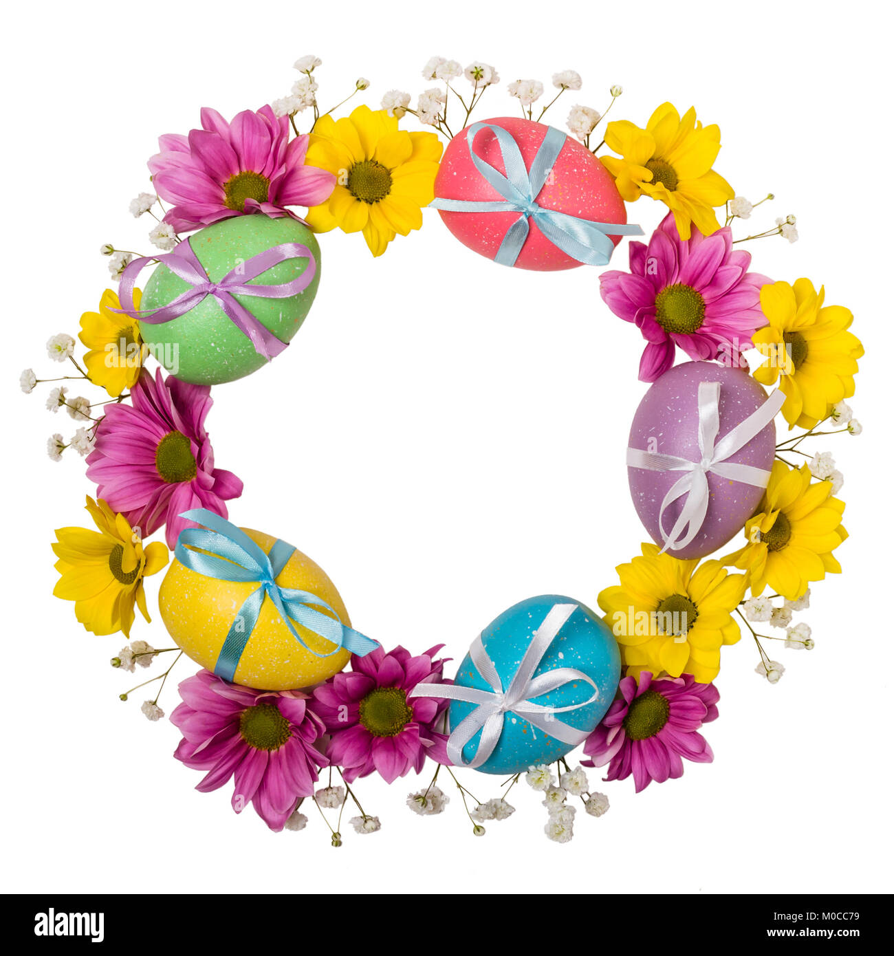 Colorful wreath of Easter eggs and flowers isolated on white background ...