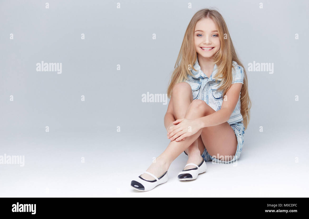 Cute little girl with long blond hair Stock Photo - Alamy