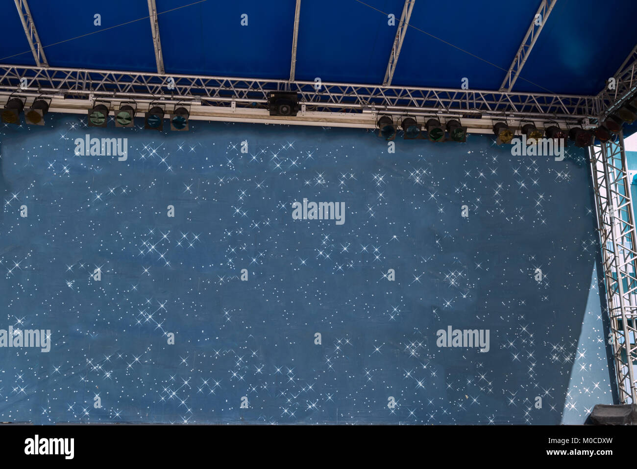 Empty Stage with Colorful Lights and Blue Background. Stock Photo