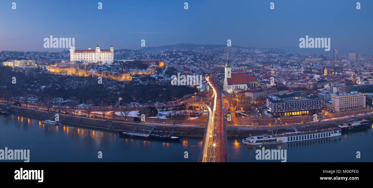 Bratislava - Panoramic skyline of the City from SNP Bridge at dusk. Stock Photo