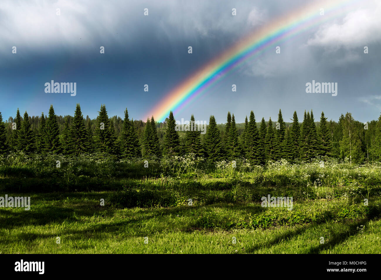 A rainbow near Uusi Valamo in Finland. Stock Photo
