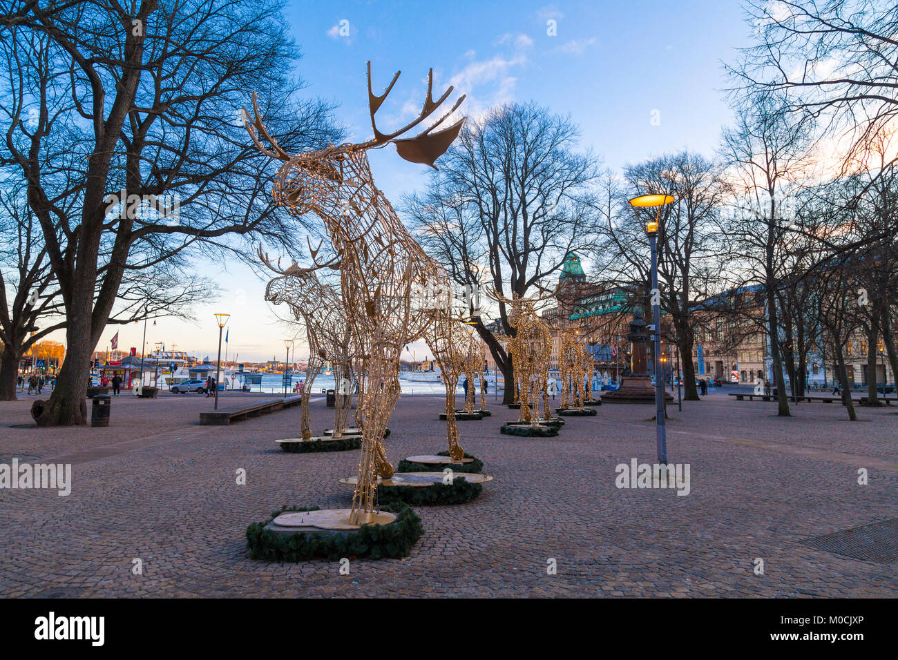 Moose sculptures made of fairy lights decorating Nybroplan for the Christmas season in Stockholm, Sweden Stock Photo