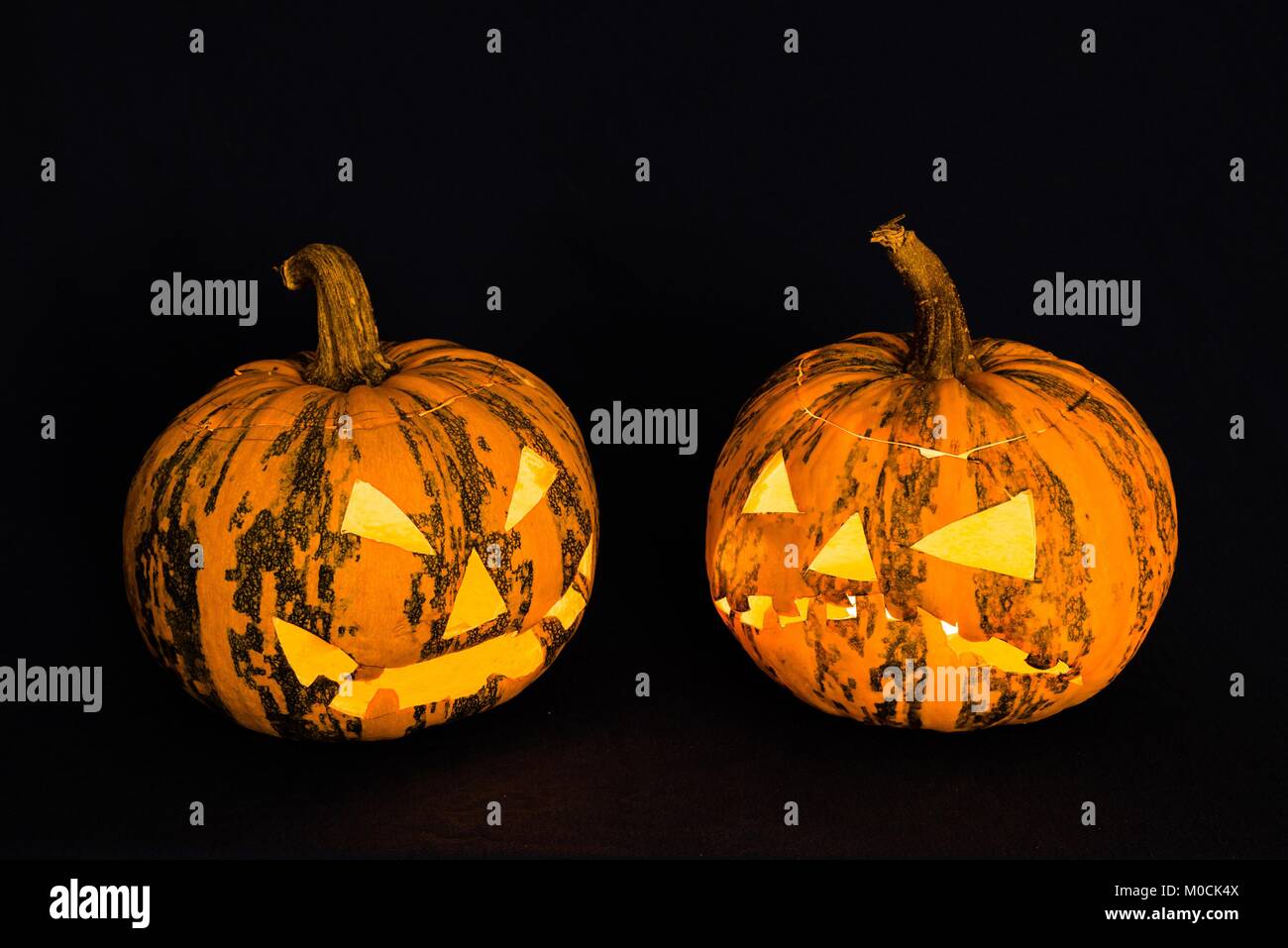 Halloween pumpkin in front of black background Stock Photo - Alamy