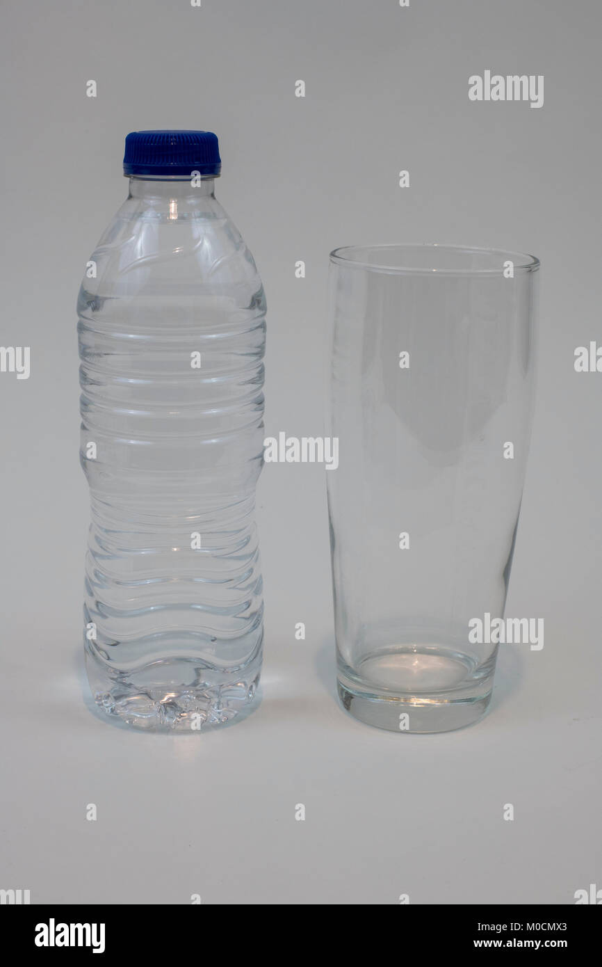 Bottle of unbranded water and glass Stock Photo Alamy