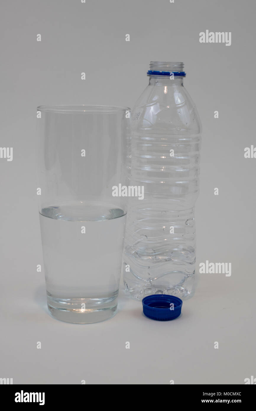 Bottle of unbranded water and glass Stock Photo Alamy