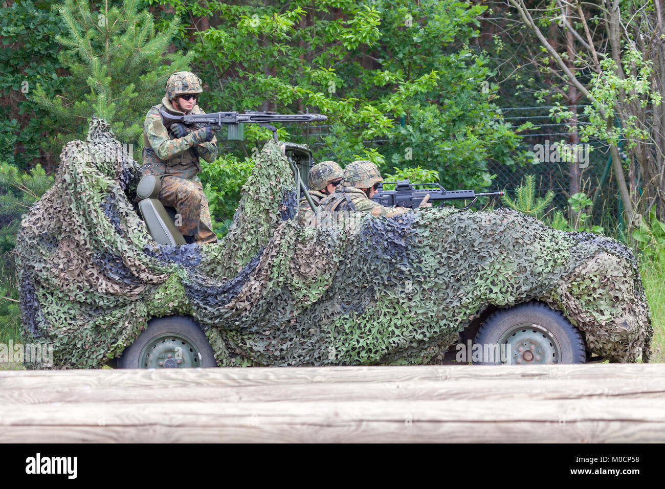 BURG / GERMANY - JUNE 25, 2016: german soldiers on mercedes benz wolf, at open day in barrack burg Stock Photo