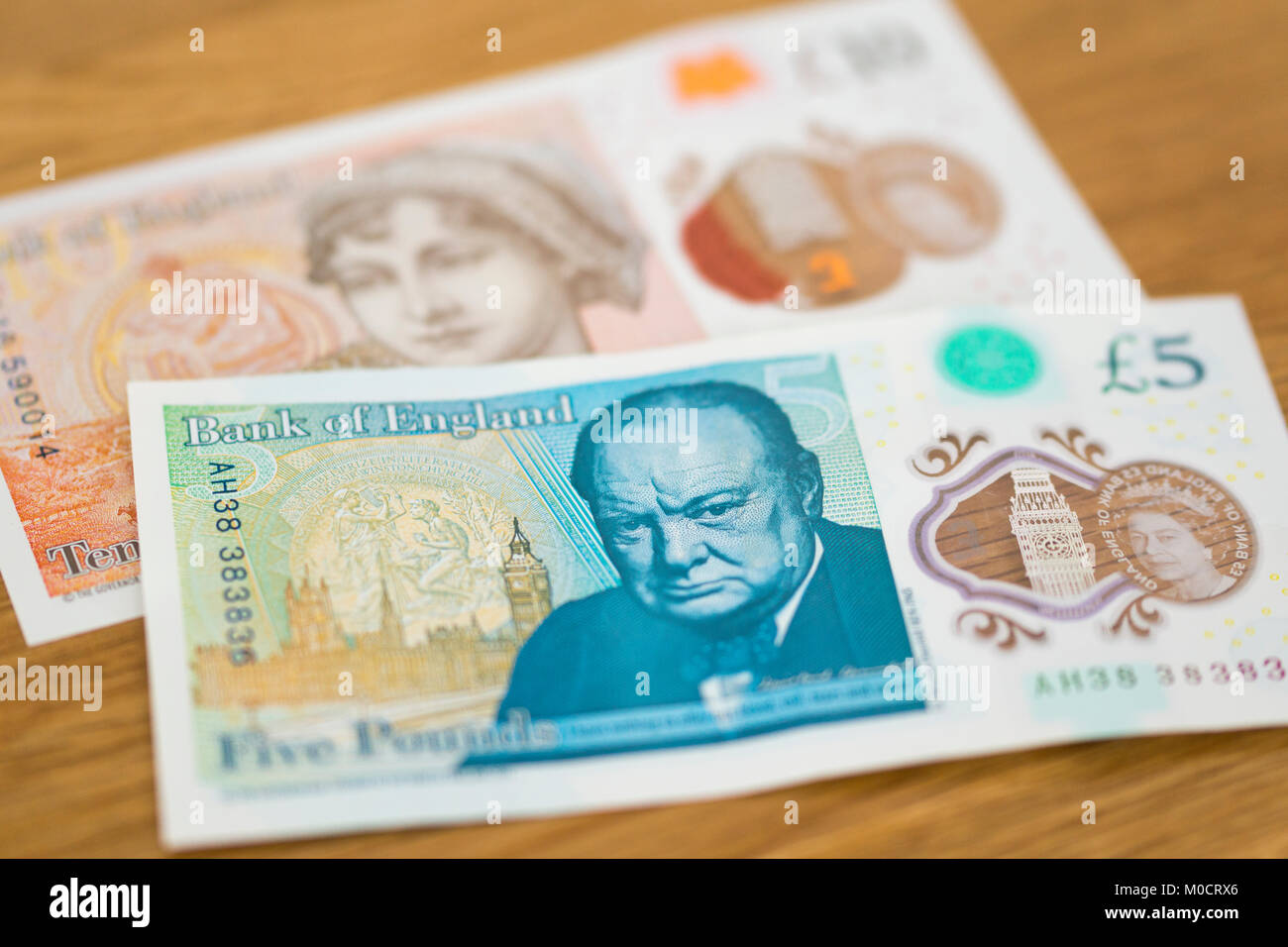 New polymer English £10 and £5 banknotes featuring Winston Churchill and Jane Austen Stock Photo