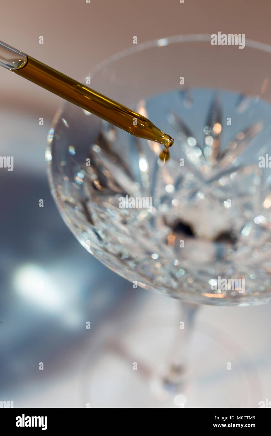 Adding aromatic bitters to a cocktail, USA Stock Photo