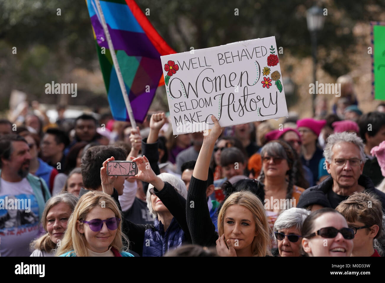 Protester holds sign as Texas women and men attend a protest rally at the Texas Capitol in Austin on the first anniversary of the Women's March on Washington and a year after President Donald Trump's inauguration. Stock Photo